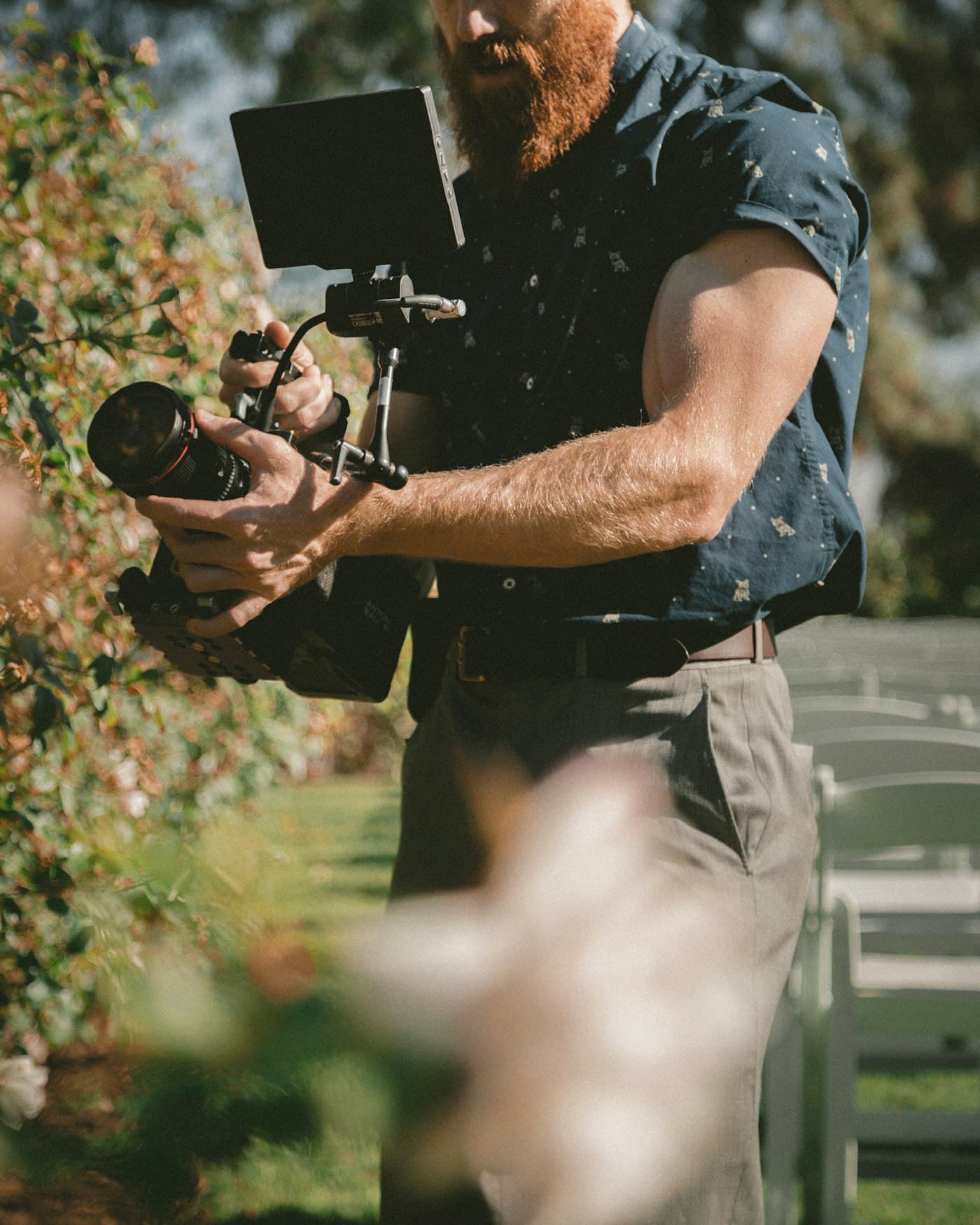 A photographer working through a viewfinder